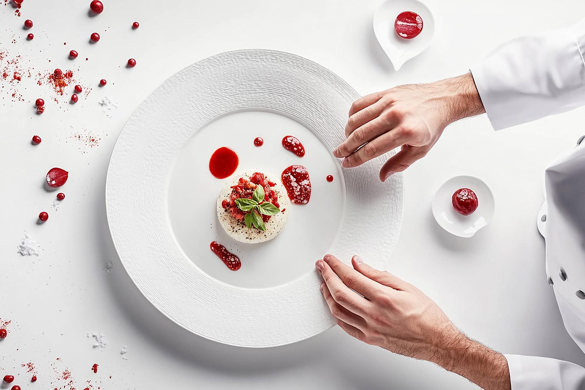 Elegant chef plating a modern dish